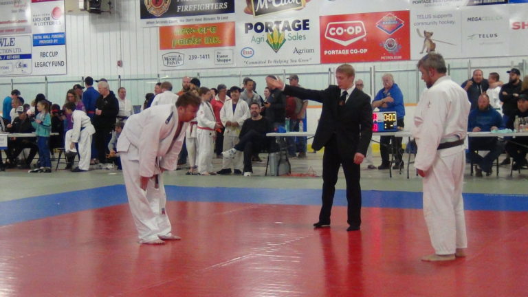 Dylan Tully refereeing at Portage