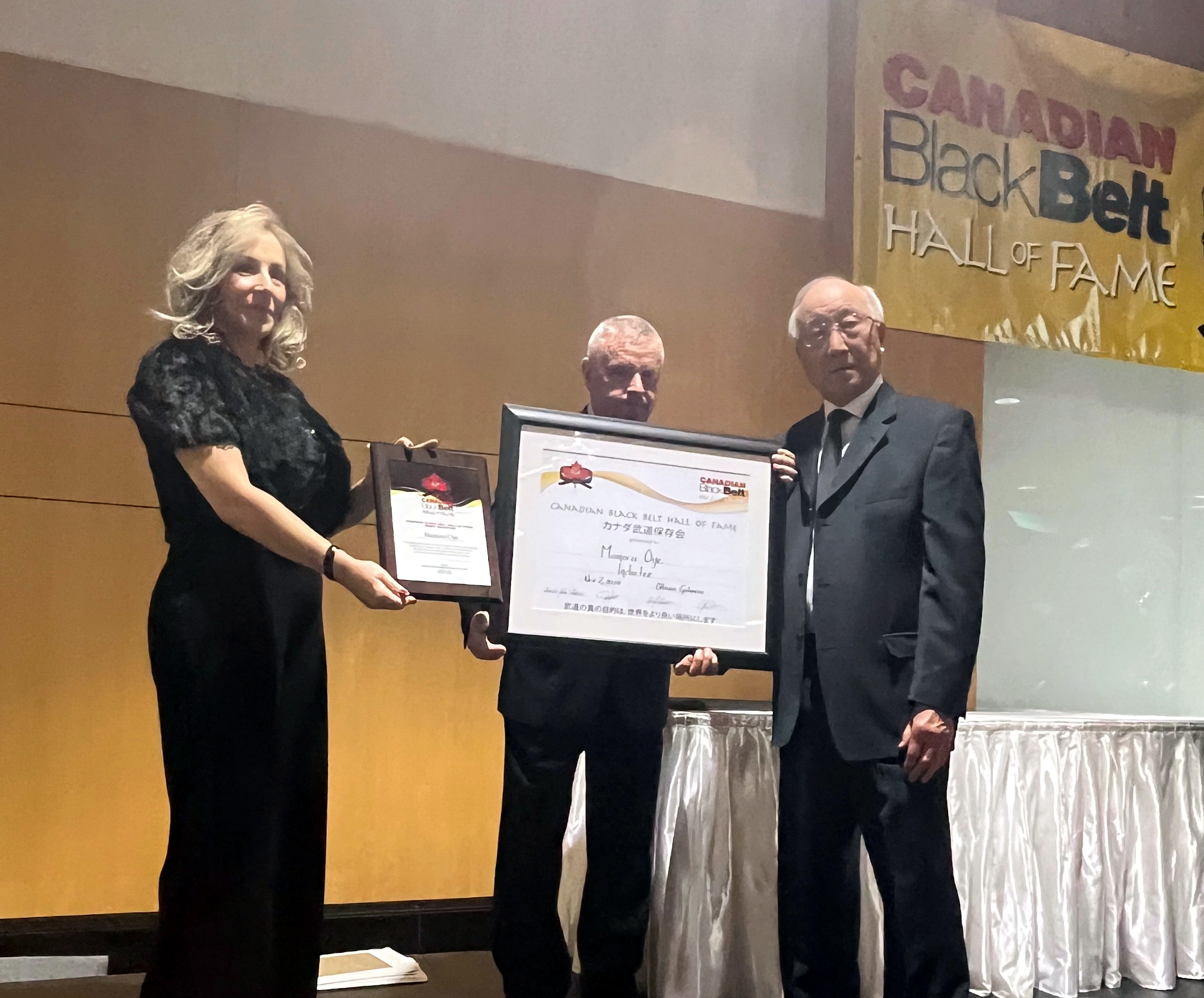 Sensei Moe Oye being inducted into the Canadian Black Belt Hall of Fame