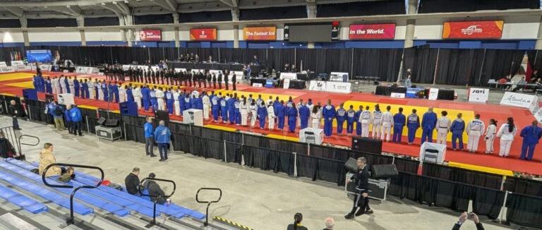 Athletes lined up on the mats at the 2025 Nationals